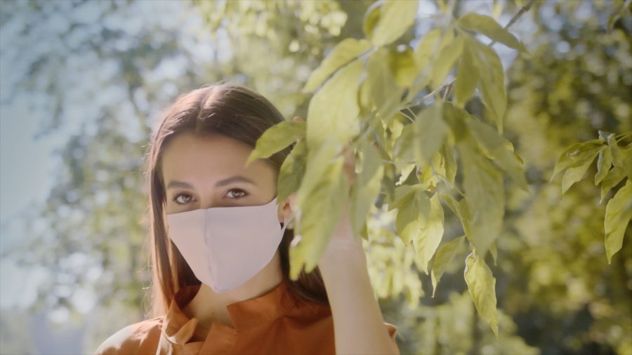 TV commercial for Japanese face mask producer: young woman wearing white mask in the park, close up on face, Dorota Dzieża